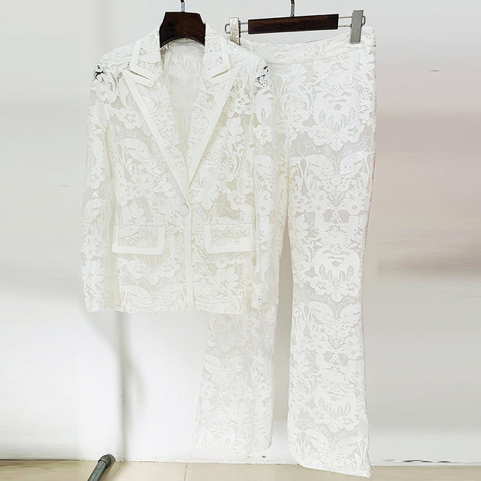 White floral-patterned suit on hangers against a white background