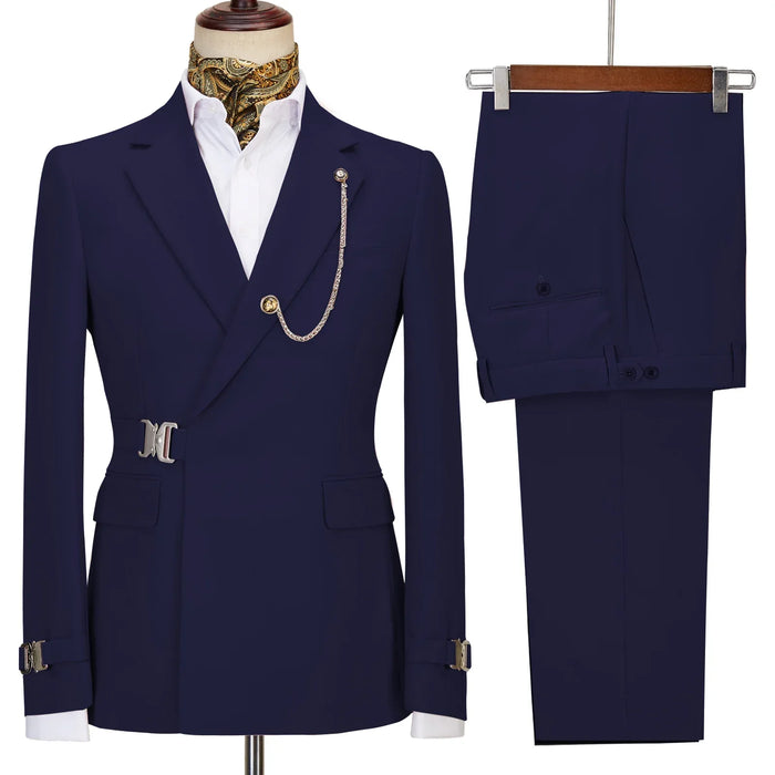 Navy blue suit jacket and pants on a mannequin and hanger against a white background