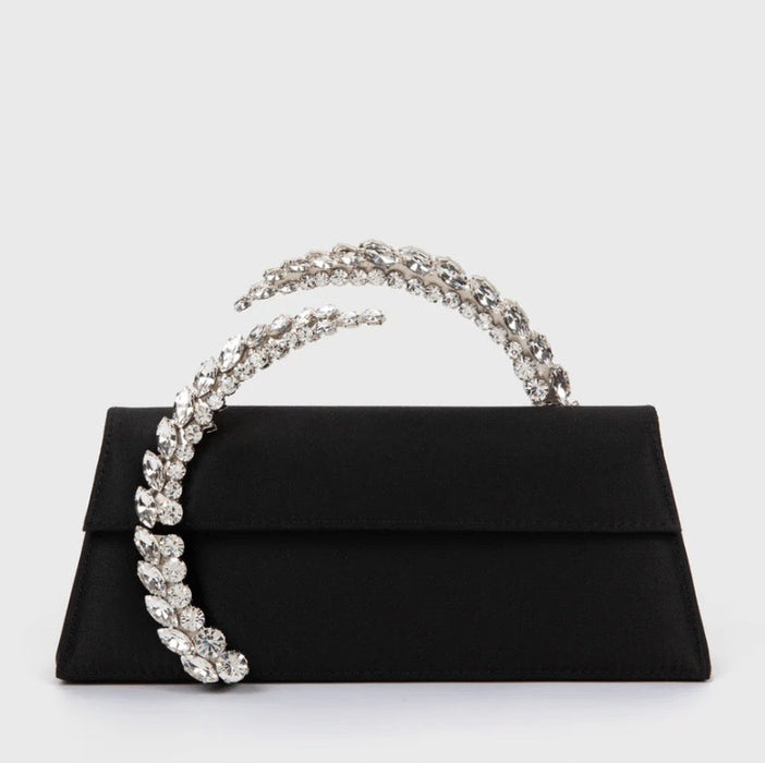 Black clutch with a decorative handle on a white background