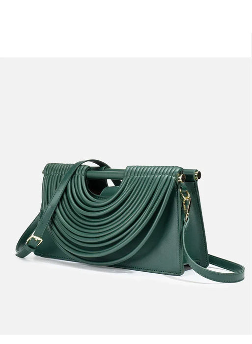 Green handbag with a unique design on a white background