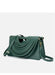 Green handbag with a unique design on a white background