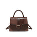 A brown handbag with a mix of textured faux-crocodile and smooth leather panels, featuring a top handle, a front strap closure with a gold-tone buckle, and a detachable shoulder strap, shown against a plain white background.