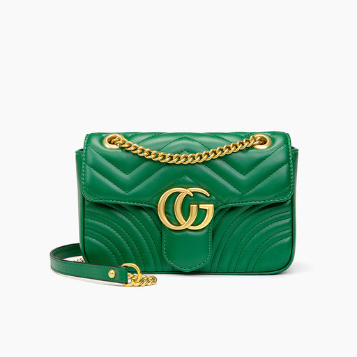 Green handbag with gold chain and logo on a white background