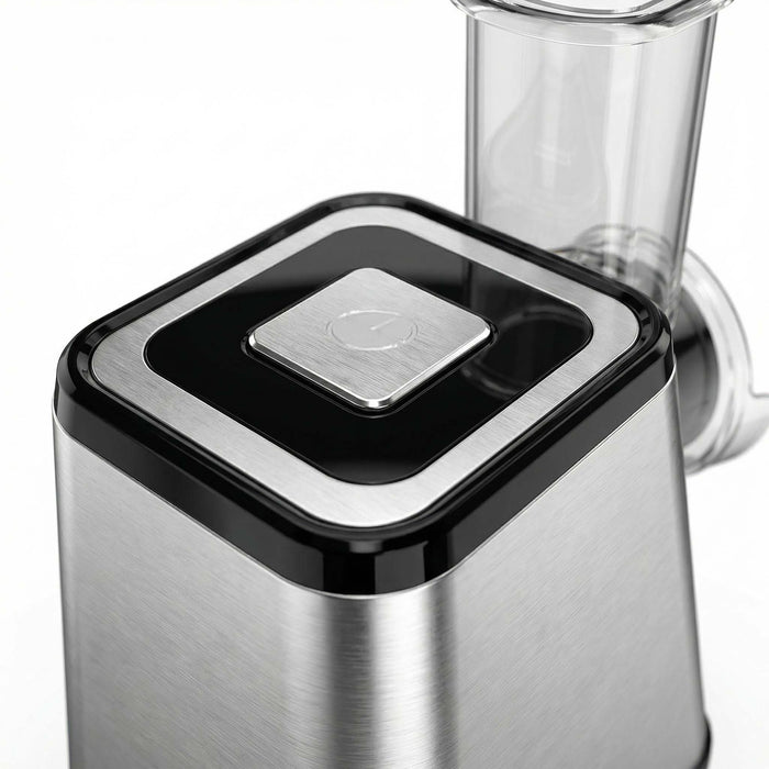 Close-up of a blender with a black and silver base on a white background