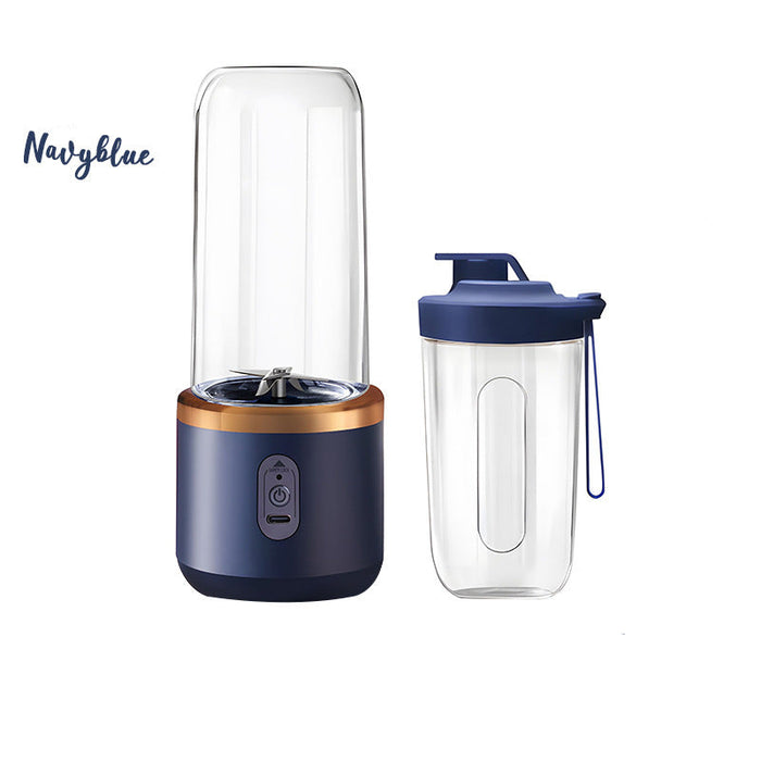 Navy blue portable blender with clear container on a white background