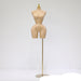 Mannequin torso on a stand against a white background