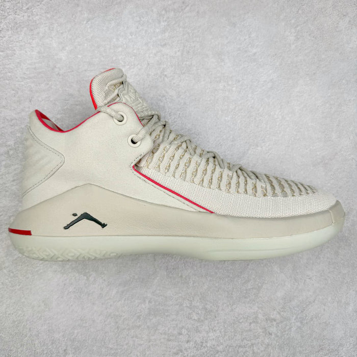 White sneaker with red accents on a light gray background
