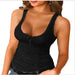Black tank top worn by a model on a white background