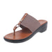 Brown sandal with a thong design on a white background