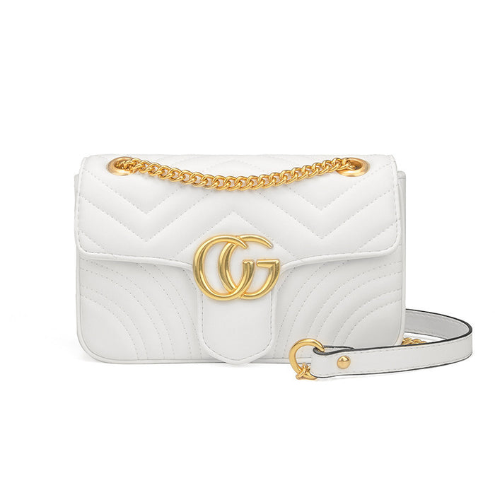 White quilted handbag with gold chain and logo on a white background