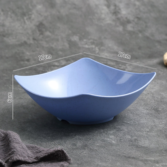 Blue ceramic bowl with dimensions on a gray surface