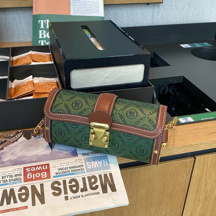 Green and brown patterned bag on a counter with tissues and newspapers in the background