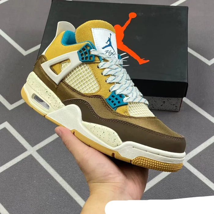 Brown and yellow sneaker with blue accents held by a hand, brand logo in the background