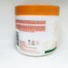 Back of a white jar with an orange lid on a white background