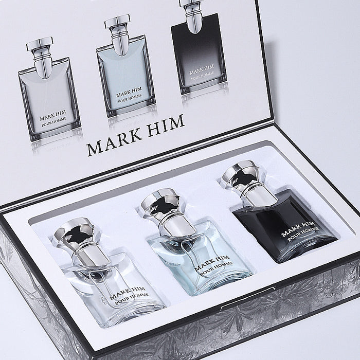 Set of 'Mark Him' perfume bottles in a decorative box on a light gray background
