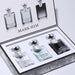 Set of 'Mark Him' perfume bottles in a decorative box on a light gray background