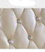 Beige leather headboard with diamond-like buttons on a white background