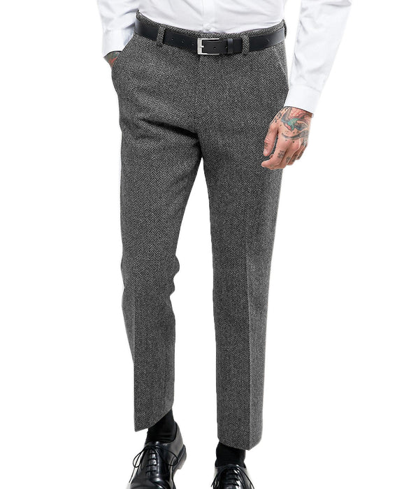 Gray herringbone dress pants worn by a person on a white background