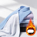 Stack of folded shirts with a fiery effect and text on a white background