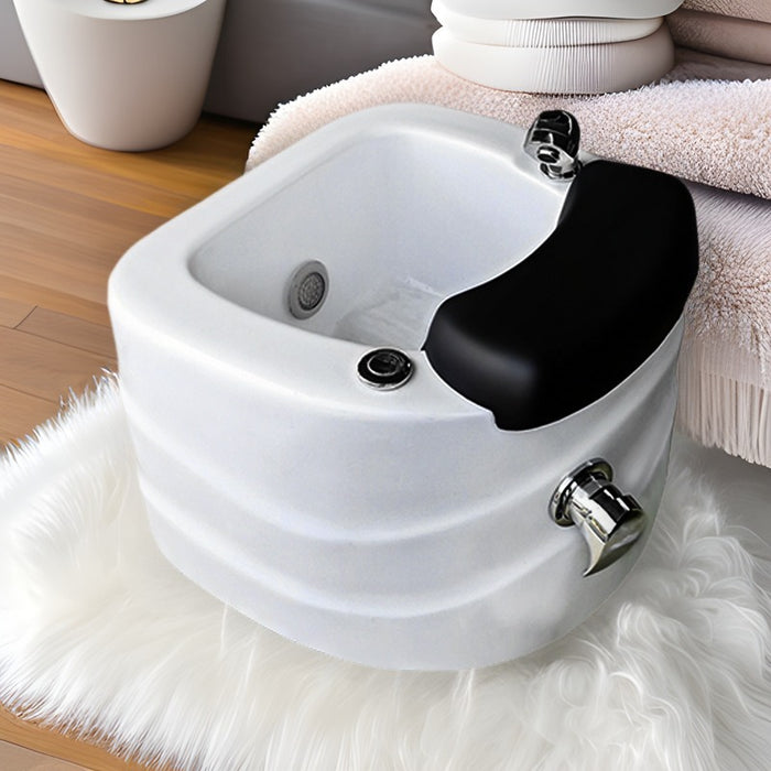 White sink with black faucet on a white rug