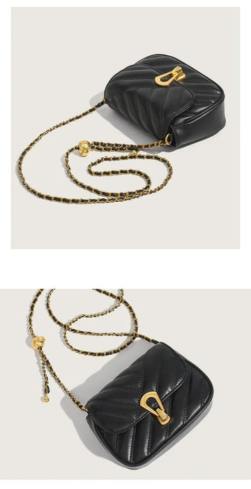 Black quilted handbag with gold chain strap on a light gray background