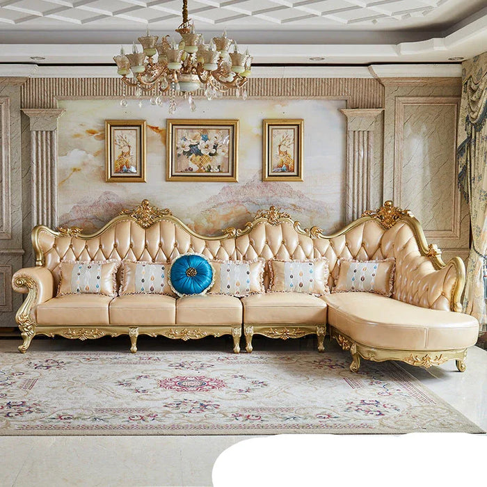 Luxurious living room with ornate sofa, chandelier, and decorative elements.
