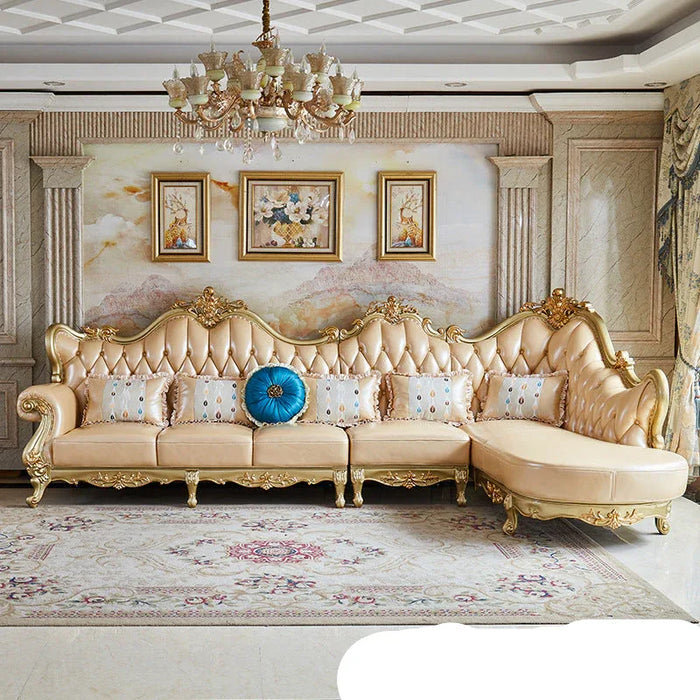Luxurious living room with ornate sofa, chandelier, and decorative elements.