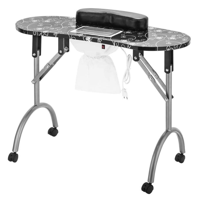 Portable nail art station with a black and white design on the table surface.