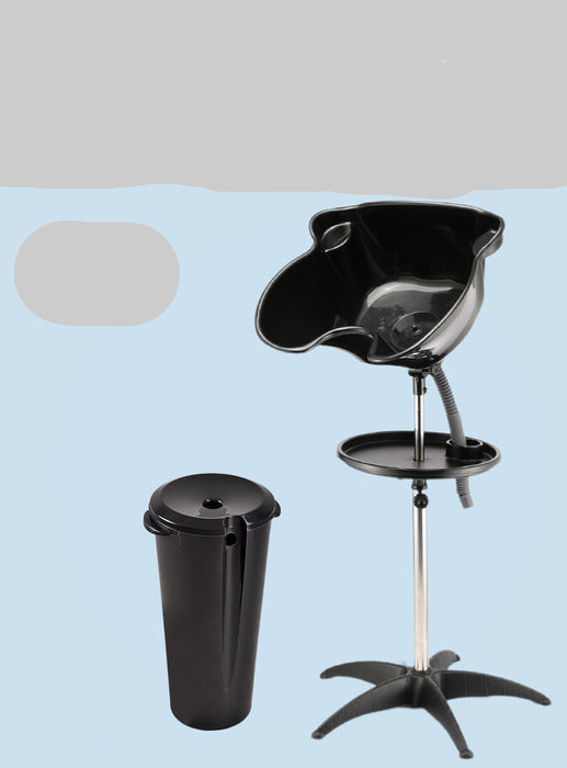 Black hair washing chair with detachable basin on a light blue background