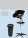 Black hair washing chair with detachable basin on a light blue background