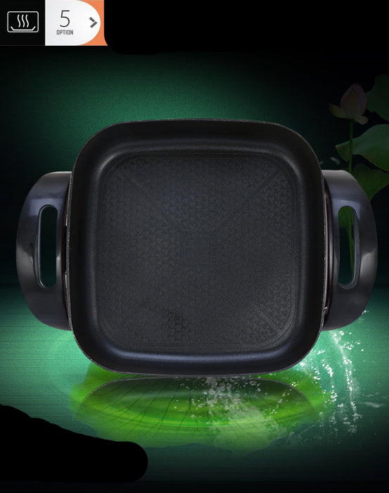 Black square grill pan with handles on a dark background