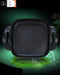 Black square grill pan with handles on a dark background