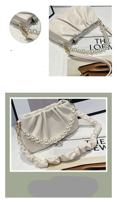 Beige handbag with pearl details on a white background