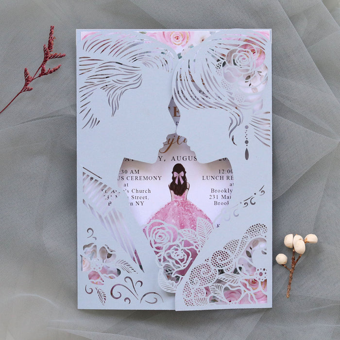 Invitation card with laser-cut design of a bride and groom on a gray background