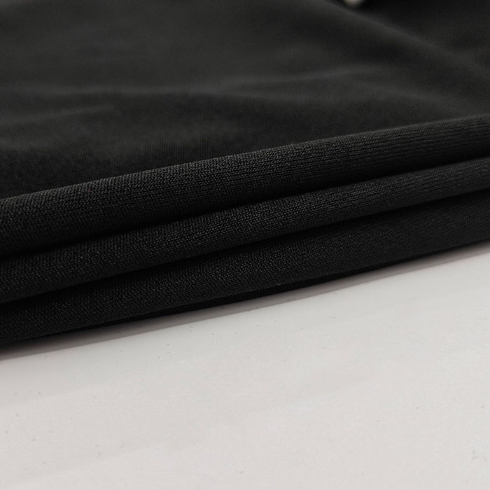 Close-up of black fabric on a white background