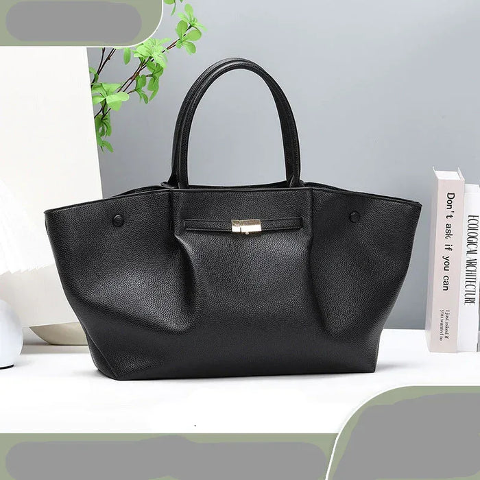 Black handbag on a light gray background with text and branding elements.