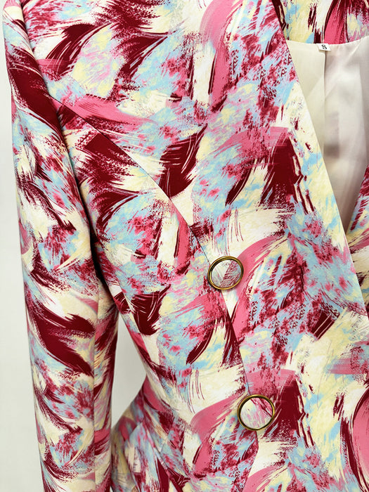 Colorful abstract patterned fabric with a button on a white background