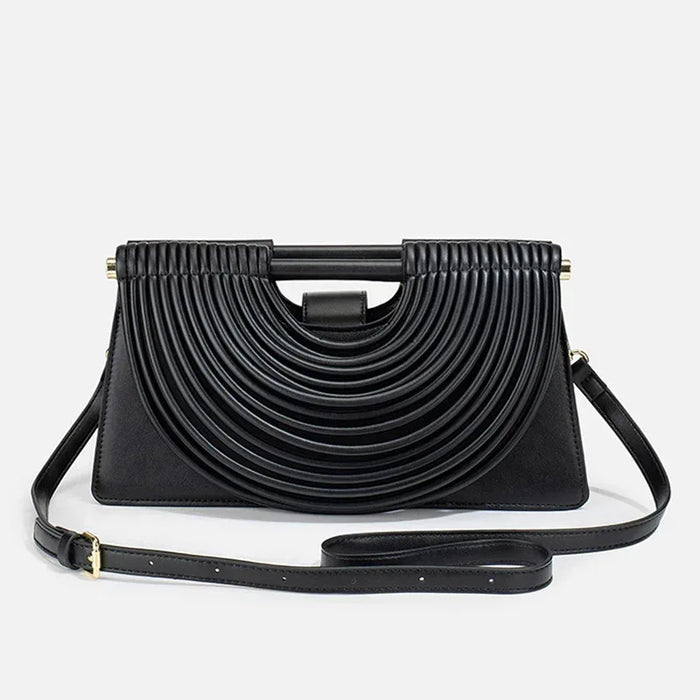 Black handbag with a unique design on a white background
