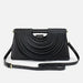 Black handbag with a unique design on a white background