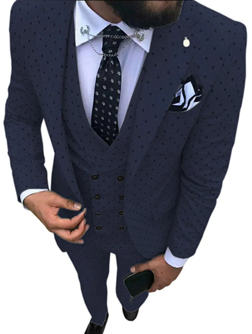 Man wearing a navy blue patterned suit with a white shirt and black tie.