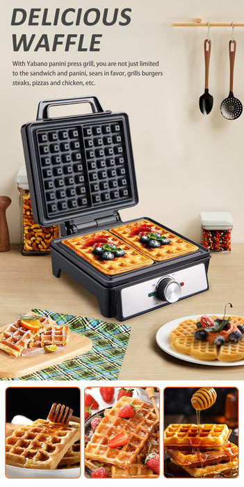 Waffle maker with waffles on a wooden table, surrounded by cooking utensils.