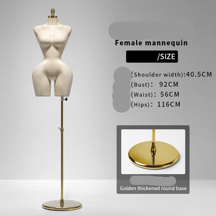 White female mannequin on a gold stand with size information displayed.