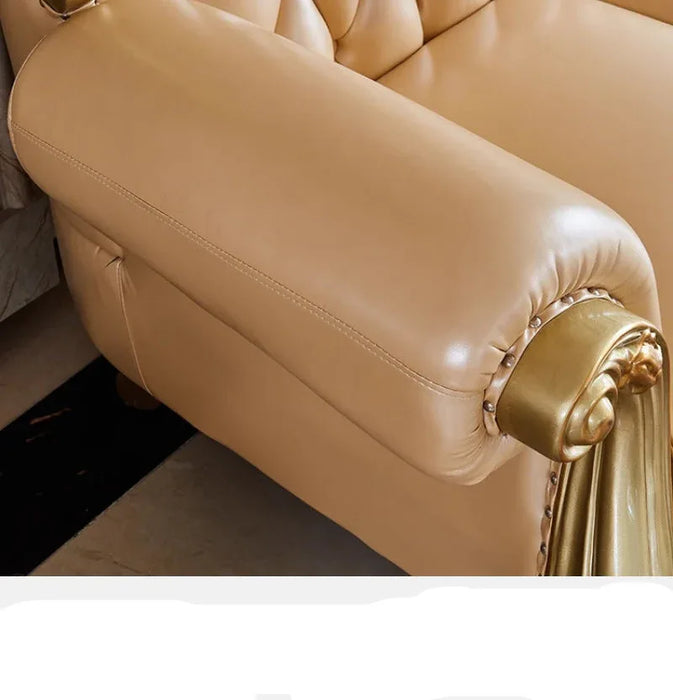 Close-up of a beige leather armchair with gold accents