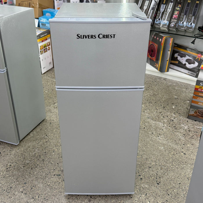 Gray refrigerator with 'Slivers Priest' branding in a store setting