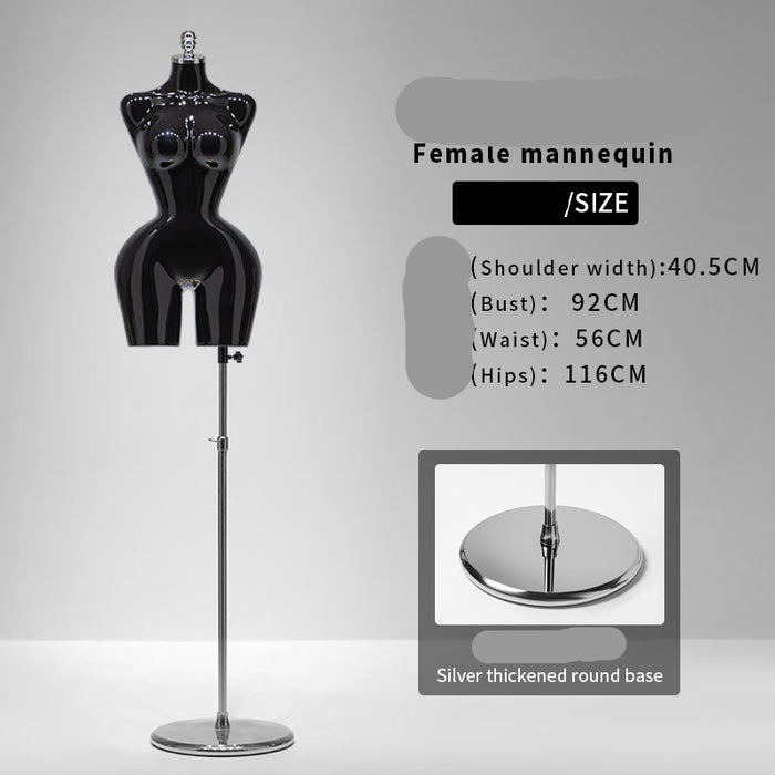 Black female mannequin with size information on a gray background