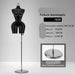Black female mannequin with size information on a gray background