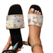 Decorative slide sandals with floral pattern on a white background