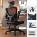 Black office chair with ergonomic features highlighted in a room setting