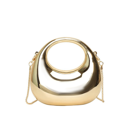 Gold handbag with a chain strap on a white background