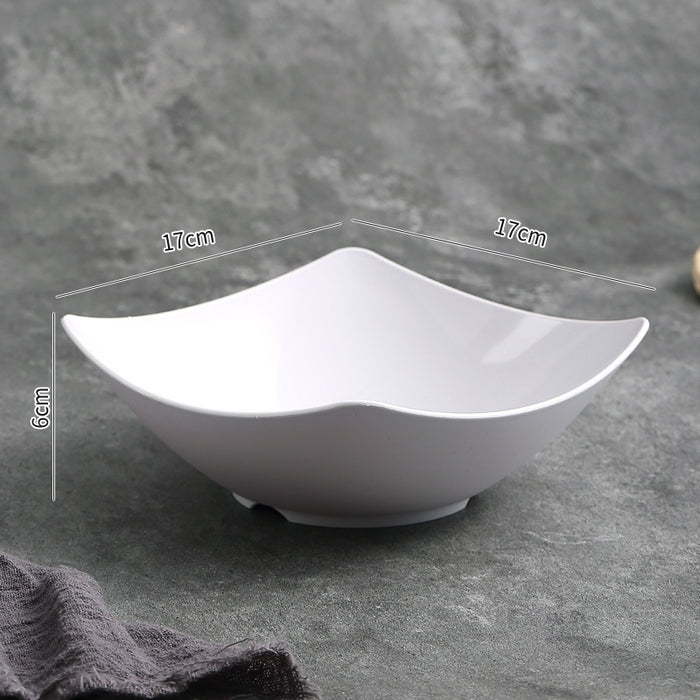 White ceramic bowl with measurements on a gray background